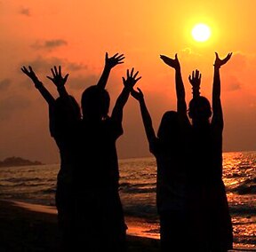 A group of people raising their hands  Description automatically generated with medium confidence