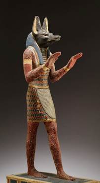 Una estatuilla de Anubis, dios egipcio con cabeza de chacal, ilustración para el tema El aspecto de las langostas de la Quinta Trompeta de Apocalipsis.
