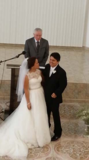 Dewayne Shappley performs a wedding ceremony in the Bayamon, Puerto Rico church of Christ meeting place.