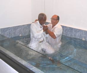 Félix Sánchez baptized by Alfonso Estrella in the church of Christ, Bayamon, Puerto Rico.