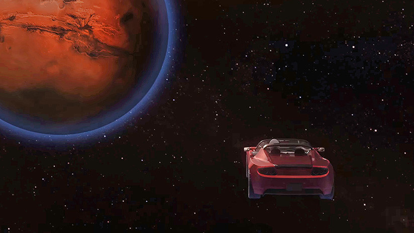 In this artistic creation, the mannequin astronaut Starman, at the wheel of his sharp-looking Tesla Roadster, comes very close to an interstellar body in his dangerous orbit around the Sun. Any asteroid, comet, bunch of rocks or dense dust in deep, black space could destroy Starman as well as the Tesla.