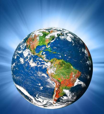 Una imagen del globo del planeta Tierra, visible el hemisferio occidental en colores vívidos, los mares en azul, con nubecillas blancas esparcidas por el globo, todo contra un trasfondo del espacio en tonalidades de azul con un gran resplandor blanco detrás del norte del globo. 
